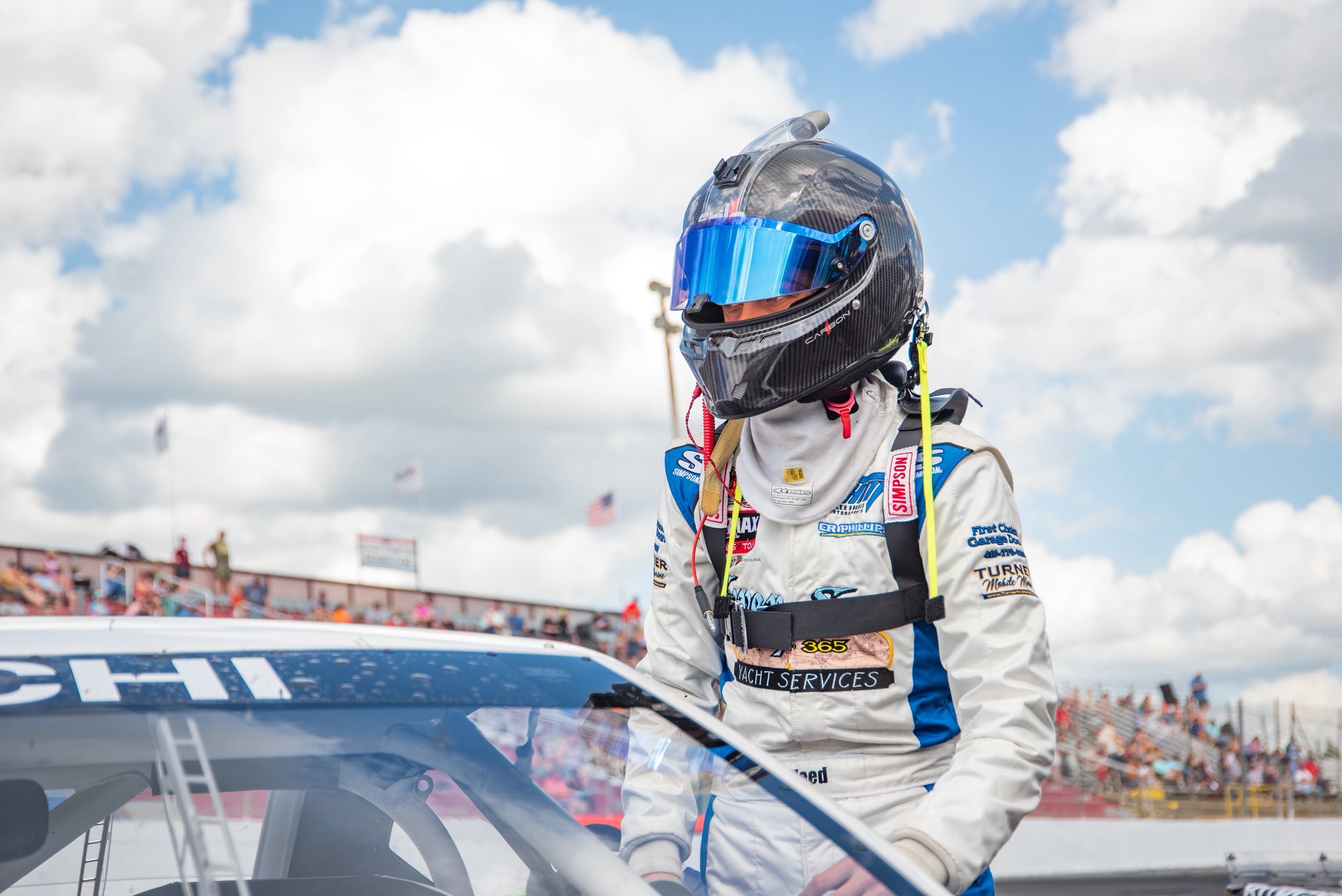 Suited up beside the car